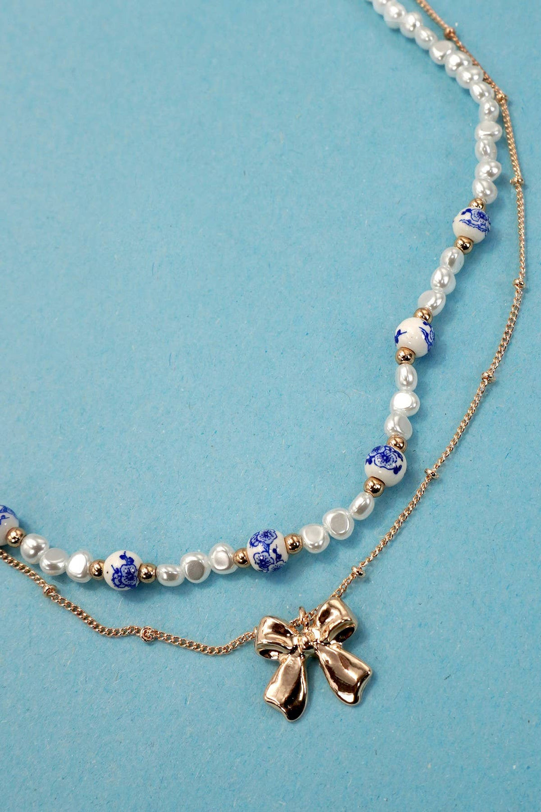 CERAMIC PORCELAIN PEARL BOW LAYER NECKLACE | 80N91555-JOSSLYN by wall to wall-Market Street Nest, Fashionable Clothing, Shoes and Home Décor Located in Mabank, TX