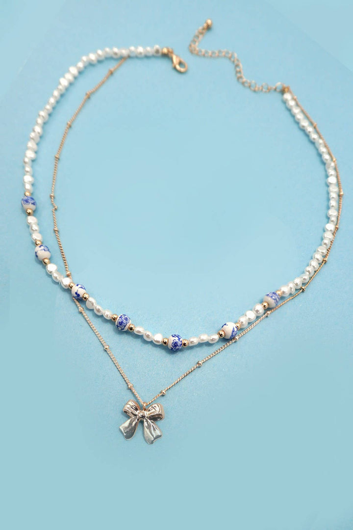 CERAMIC PORCELAIN PEARL BOW LAYER NECKLACE | 80N91555-JOSSLYN by wall to wall-Market Street Nest, Fashionable Clothing, Shoes and Home Décor Located in Mabank, TX