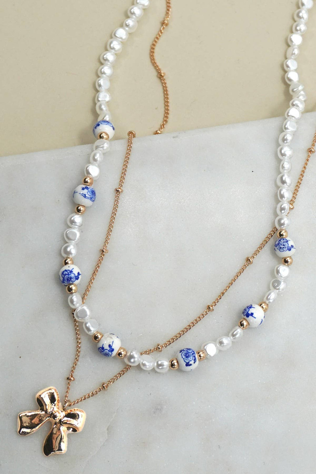 CERAMIC PORCELAIN PEARL BOW LAYER NECKLACE | 80N91555-JOSSLYN by wall to wall-Market Street Nest, Fashionable Clothing, Shoes and Home Décor Located in Mabank, TX