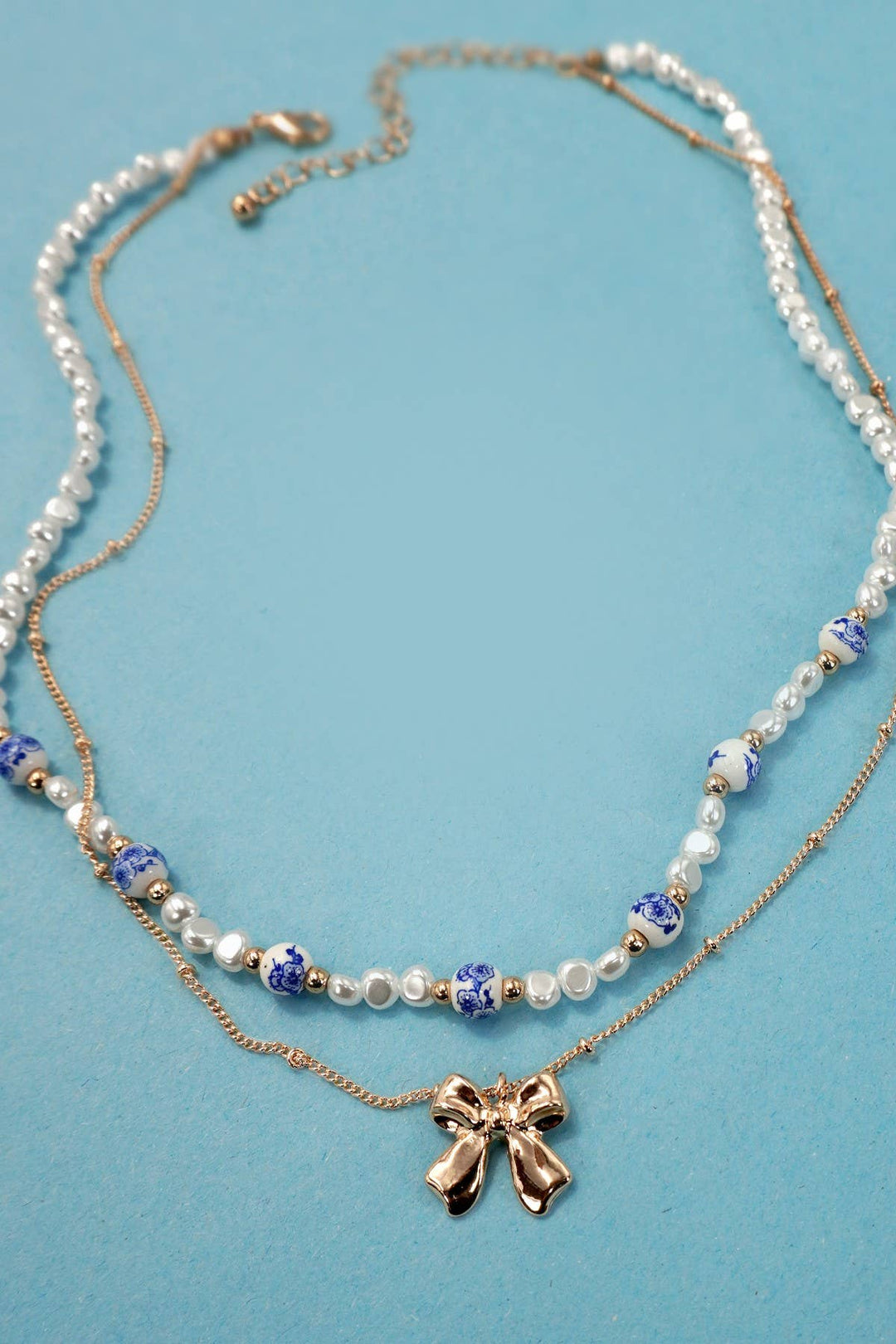 CERAMIC PORCELAIN PEARL BOW LAYER NECKLACE | 80N91555-JOSSLYN by wall to wall-Market Street Nest, Fashionable Clothing, Shoes and Home Décor Located in Mabank, TX